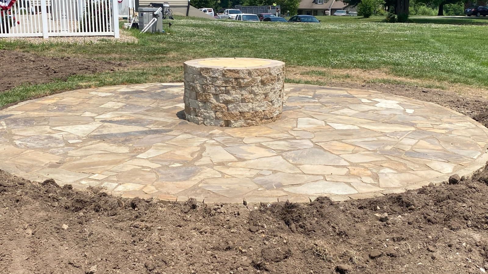Charm Your Yard with a Rustic Stone Patio image