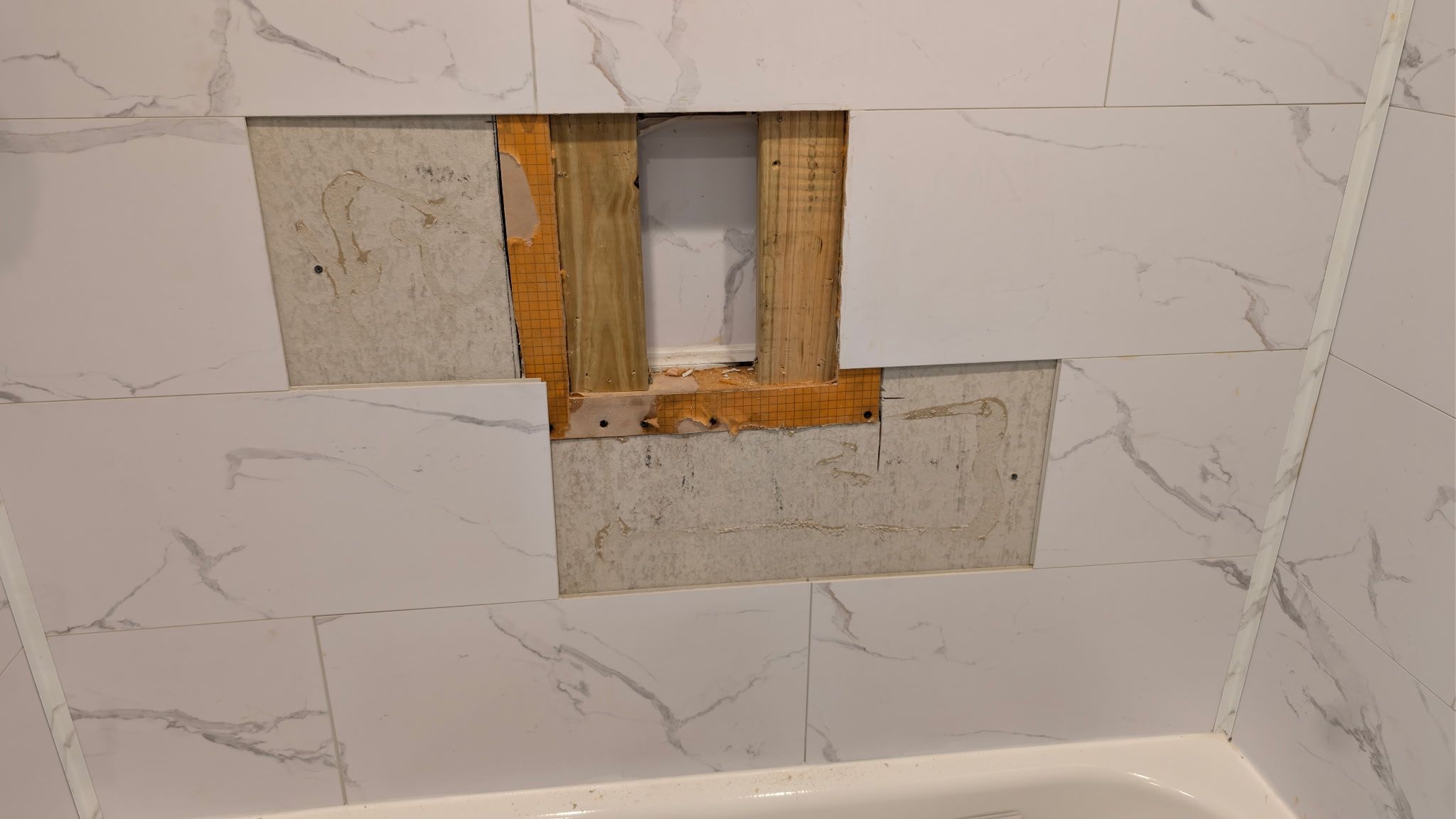 Closing Up a Built-In Shelf for a Cleaner Bathroom Wall